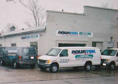 aquatek van in front of building
